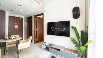 Deluxe Apartment, Balcony, Lake View | Living area | 50-inch Smart TV with digital channels
