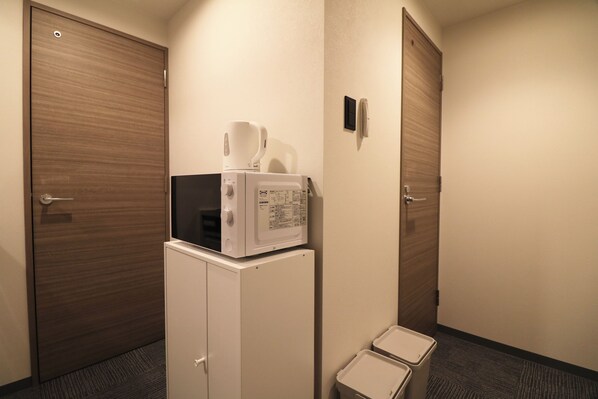 Full-size fridge, microwave, stovetop, rice cooker