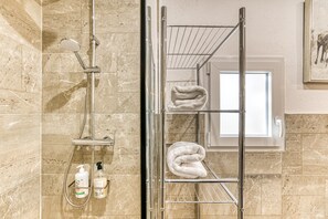 Shower, hair dryer, towels
