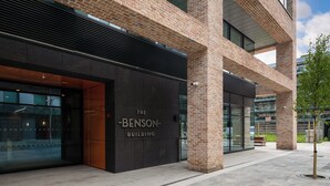 A modern building with a prominent entrance labeled "The Benson Building." - The Benson Building (Dublin)