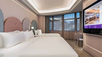 Family Room | Premium bedding, free minibar, in-room safe, laptop workspace