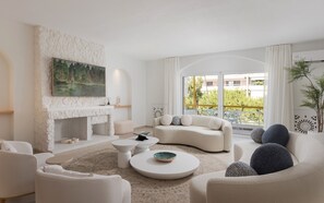 Deluxe Apartment, Balcony, City View | Living area | 65-inch Smart TV with digital channels, Netflix, streaming services - Arche Residence Glyfada (Glyfada)