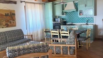 Family Villa | Living area | Flat-screen TV