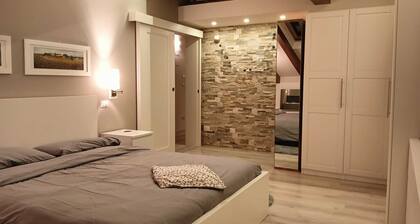 Elegante Dachwohnung mit Dolomitenblick, Entspannung und Natur in Levico Terme.