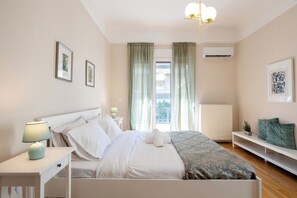 Apartment, 2 Bedrooms, Balcony, City View | Desk, laptop workspace, blackout drapes, iron/ironing board