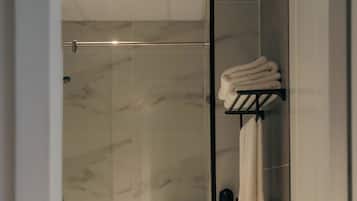 Shower, hair dryer, slippers, towels