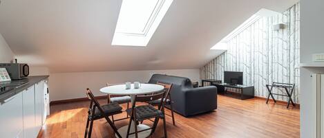 Apartment (1 Bedroom) | Living area | 32-inch Smart TV with cable channels