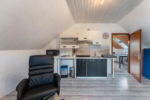 Fridge, microwave, stovetop, coffee/tea maker