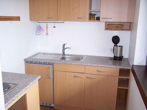 Fridge, stovetop, coffee/tea maker, electric kettle