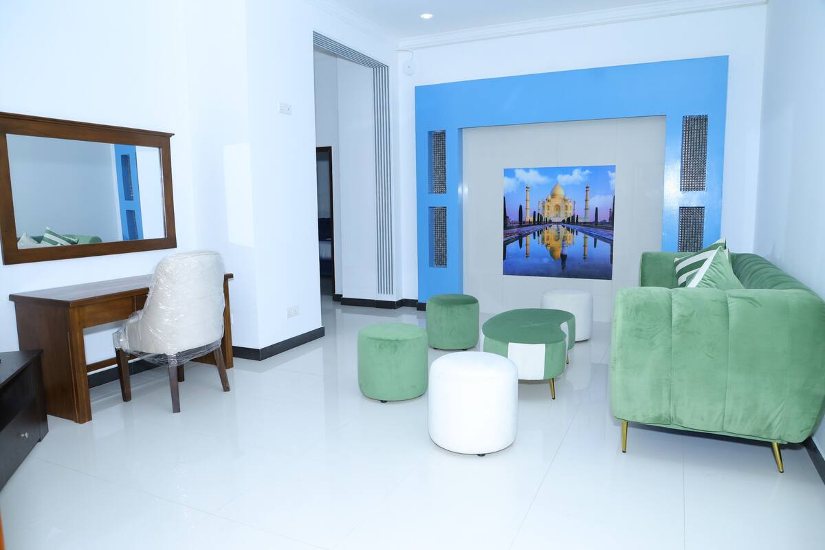 Deluxe Apartment, 2 Bedrooms, Pool Access, Garden View | Minibar, desk, laptop workspace, blackout curtains