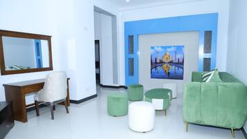 Deluxe Apartment, 2 Bedrooms, Pool Access, Garden View | Minibar, desk, laptop workspace, blackout curtains