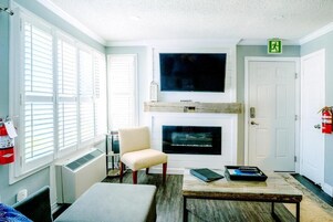Standard Apartment, 1 Queen Bed with Sofa bed, Balcony, Mountain View | Living area | Flat-screen TV, fireplace