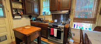 Charming 2-bedroom cottage with fenced yard is pet friendly and waiting for you!