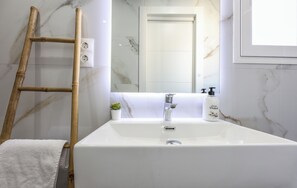 Shower, towels, soap, toilet paper