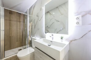 Shower, towels, soap, toilet paper