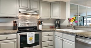 Fridge, microwave, oven, stovetop - Oceanfront Condo 117 in Kailua-kona (Kailua-Kona)