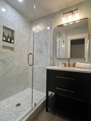 Shower, hair dryer, towels, soap