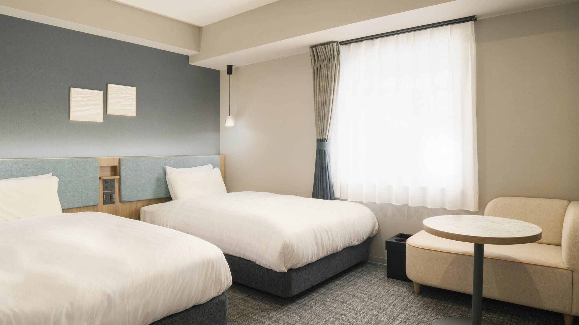Premium bedding, laptop workspace, blackout drapes, soundproofing