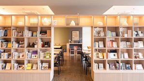 A bookstore with wooden shelves and tables, featuring books and decorative items. - Comfort Hotel Mito (Mito)