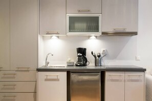 Fridge, microwave, coffee/tea maker, cookware/dishes/utensils