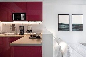 Fridge, microwave, coffee/tea maker, cookware/dishes/utensils