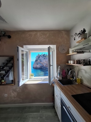 Fridge, electric kettle, cookware/dishes/utensils