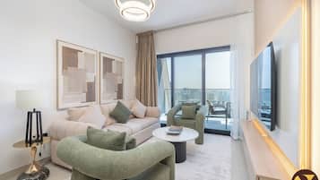 Luxury Apartment, Balcony, Harbour View | Living area | 65-inch Smart TV with cable channels