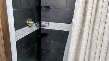 Shower, towels, soap, toilet paper