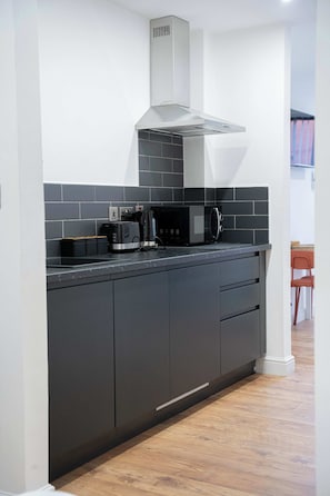 Fridge, microwave, toaster, cookware/dishes/utensils