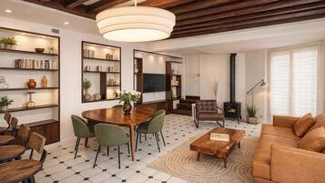 Signature Apartment, Courtyard View | Living area | 108-cm Smart TV with digital channels