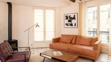 Signature Apartment, Courtyard View | Living area | 108-cm Smart TV with digital channels