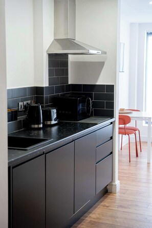 Fridge, microwave, toaster, cookware/dishes/utensils