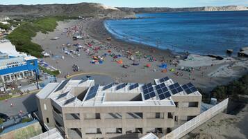 On the beach, black sand