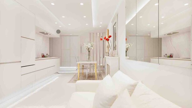 A modern, minimalist hotel room with a white color scheme, a large mirror, and a glass coffee table. - La Perle - T2 with terrace, air conditioning & parking near Toulouse city center (Toulouse)