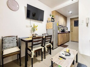 Condo, 1 Bedroom, Balcony, City View | Dining room - The Golden Shore Suites (Pasay)