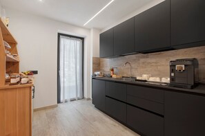 Fridge, electric kettle, high chair