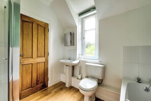 Separate tub and shower, deep soaking tub, towels