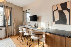 Superior Apartment, Garden View | Living area | 80-cm Smart TV with digital channels - 1598 Ingres (Paris)