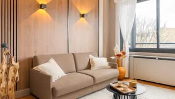 Superior Apartment, Garden View | Living area | 80-cm Smart TV with digital channels