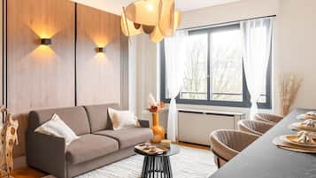 Superior Apartment, Garden View | Living area | 80-cm Smart TV with digital channels