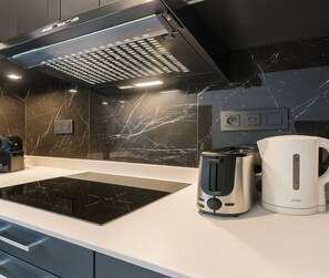 Superior Apartment, Garden View | Private kitchen | Espresso maker, electric kettle, toaster, freezer - 1598 Ingres (Paris)