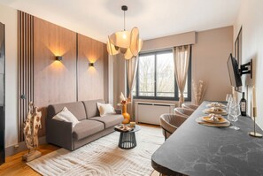 Superior Apartment, Garden View | Living area | 80-cm Smart TV with digital channels - 1598 Ingres (Paris)