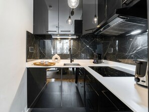 Superior Apartment, Garden View | Private kitchen | Espresso maker, electric kettle, toaster, freezer - 1598 Ingres (Paris)