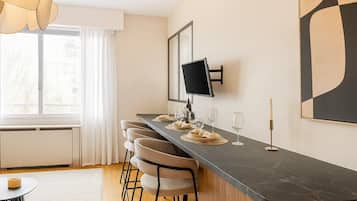 Superior Apartment, Garden View | Living area | 80-cm Smart TV with digital channels