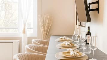 Superior Apartment, Garden View | Living area | 80-cm Smart TV with digital channels