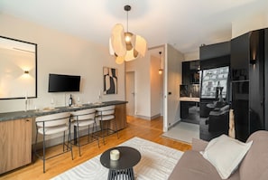 Superior Apartment, Garden View | Living area | 80-cm Smart TV with digital channels - 1598 Ingres (Paris)