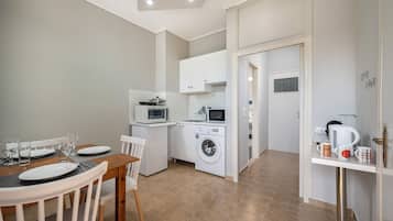 Classic Triple Room, Balcony, Garden View | Private kitchen | Full-sized fridge, microwave, stovetop, espresso maker
