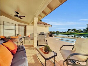 A covered patio with a pool, outdoor furniture, and a grill. - Oleander 2 Chandler/ocotillo (Chandler)