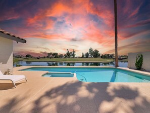 A swimming pool with a view of a golf course and a sunset sky. - Oleander Ocotillo Chandler Complex (Chandler)