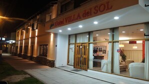 A hotel named "Villa del Sol" with a visible reception area and a well-lit entrance. - Hotel Villa del Sol (Villa Gesell)